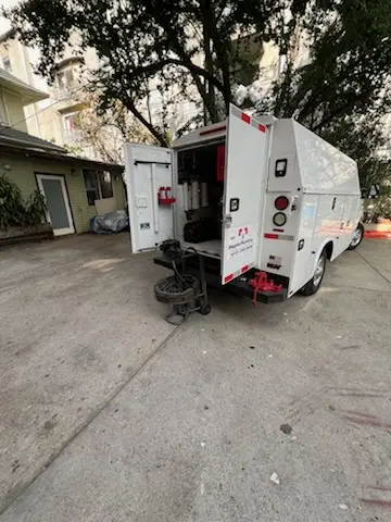 Magnet Plumbing service vehicle on-site for Grease Trap Cleaning in Mission Green North